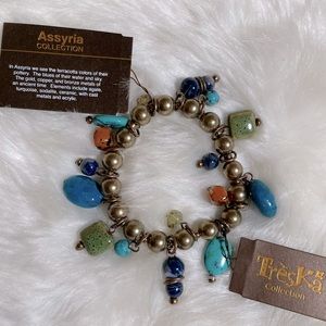 Treska bracelet. Stretch beaded Assyria collection. Blue green gold.